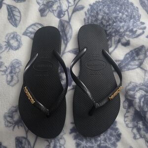 Havaianas Black Slim Flip Flops with Gold Logo Chain
